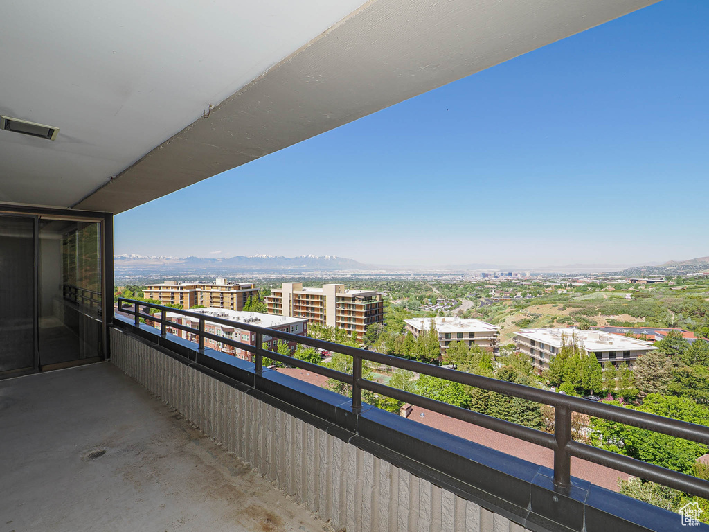 Balcony with a mountain view and a city view