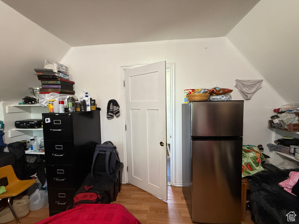Home office with wood finished floors