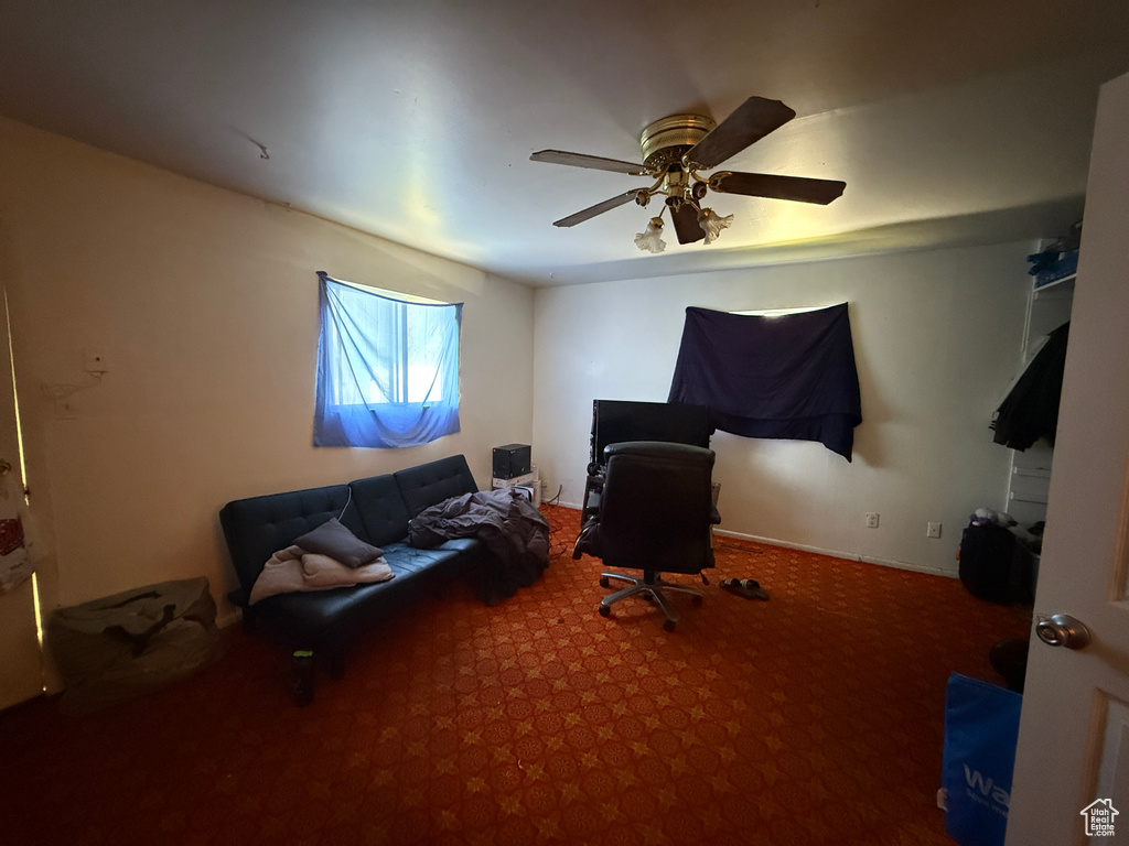 Sitting room featuring carpet floors and ceiling fan