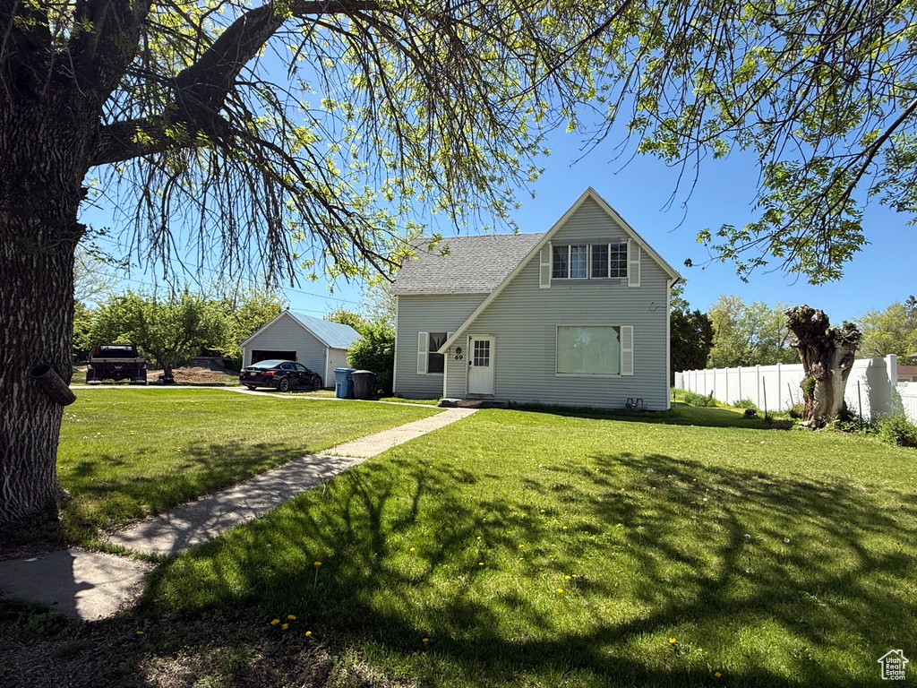 Rear view of property featuring a garage