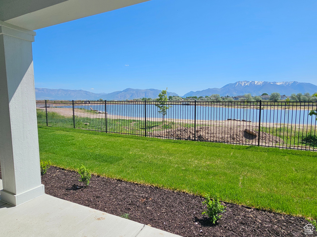 View of yard featuring a water and mountain view
