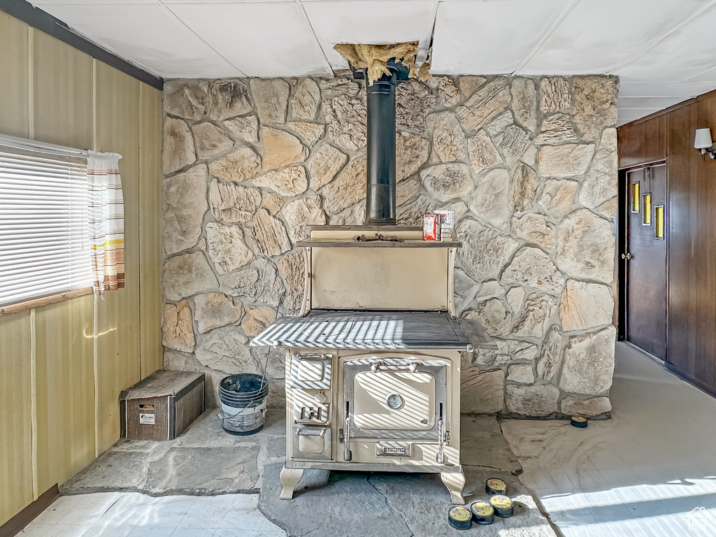 Detailed view of a wood stove and wooden walls