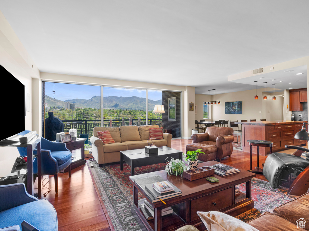 Living area featuring hardwood / wood-style floors and a mountain view
