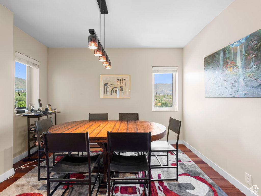 Dining area with wood finished floors and baseboards