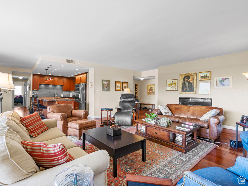 Living room featuring wood finished floors and baseboards