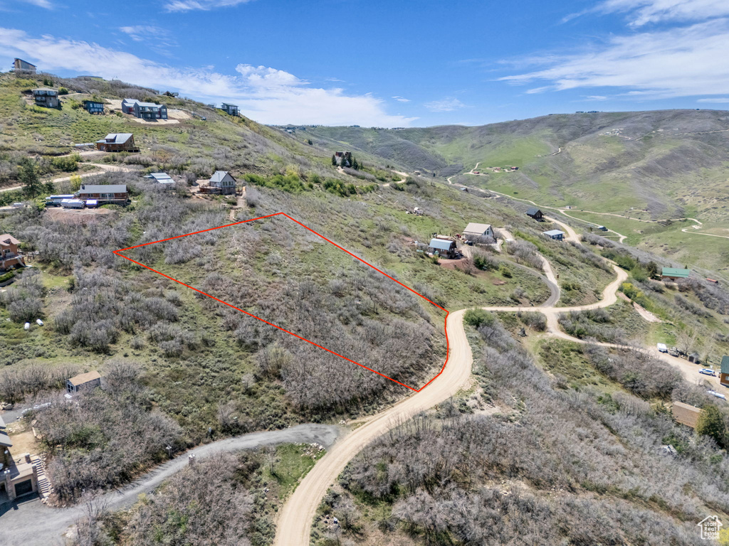 View of rural area featuring property parcel outlined and a mountain backdrop