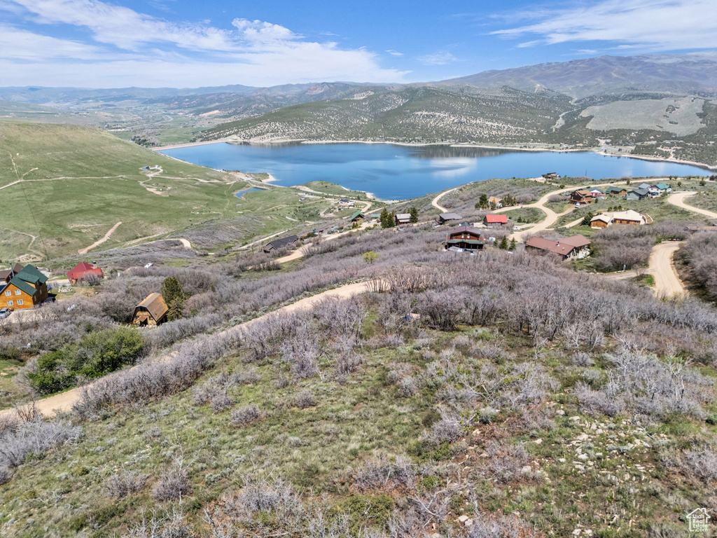 View of property location with a water and mountain view