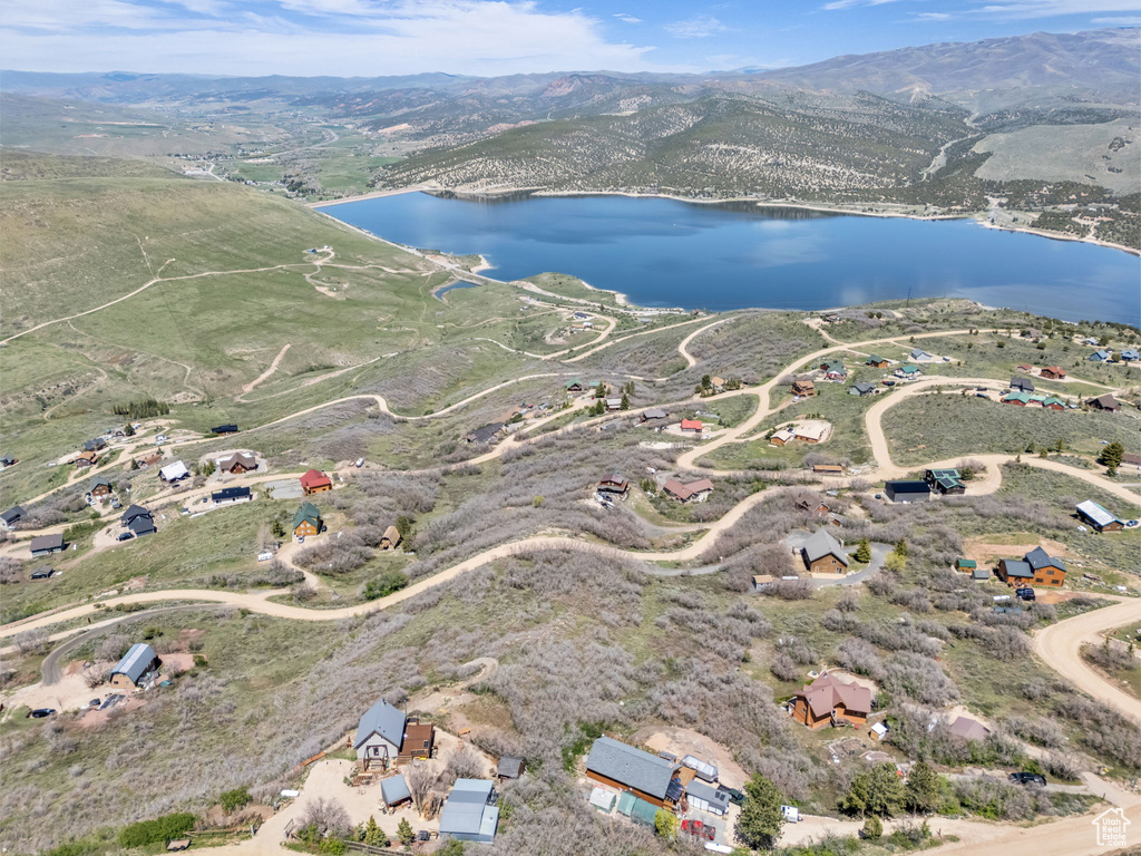 Aerial view of property\'s location featuring a water and mountain view