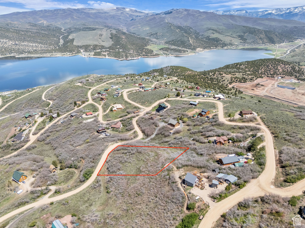 Aerial view of property\'s location featuring a water and mountain view and property boundaries highlighted