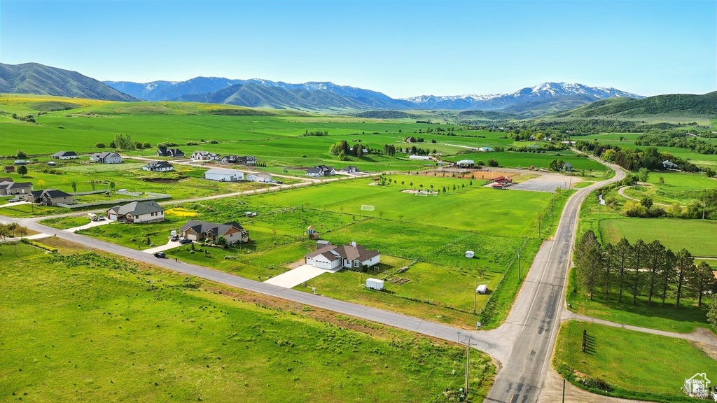 View of rural area featuring mountains and a pastoral area