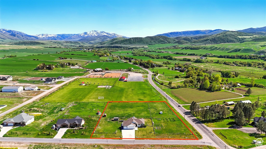 View of rural area with property boundaries highlighted and a mountainous background