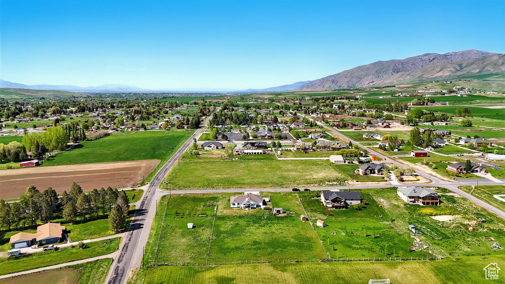 Aerial perspective of suburban area featuring a mountain backdrop
