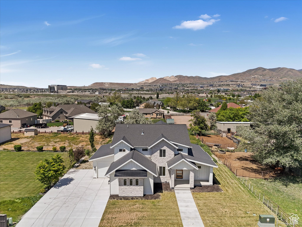Aerial perspective of suburban area featuring a mountainous background