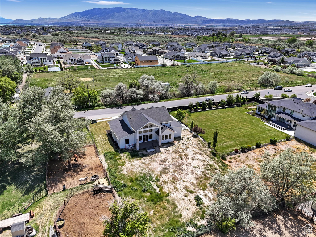 Aerial view of residential area featuring a mountainous background