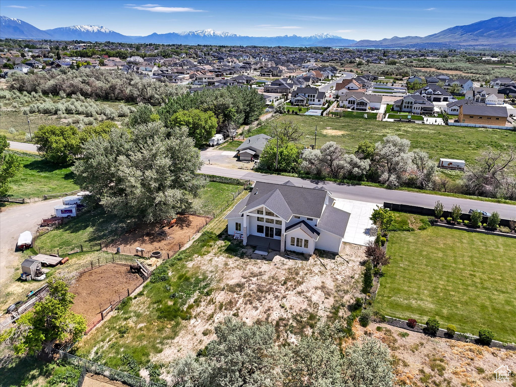 Aerial perspective of suburban area featuring a mountainous background