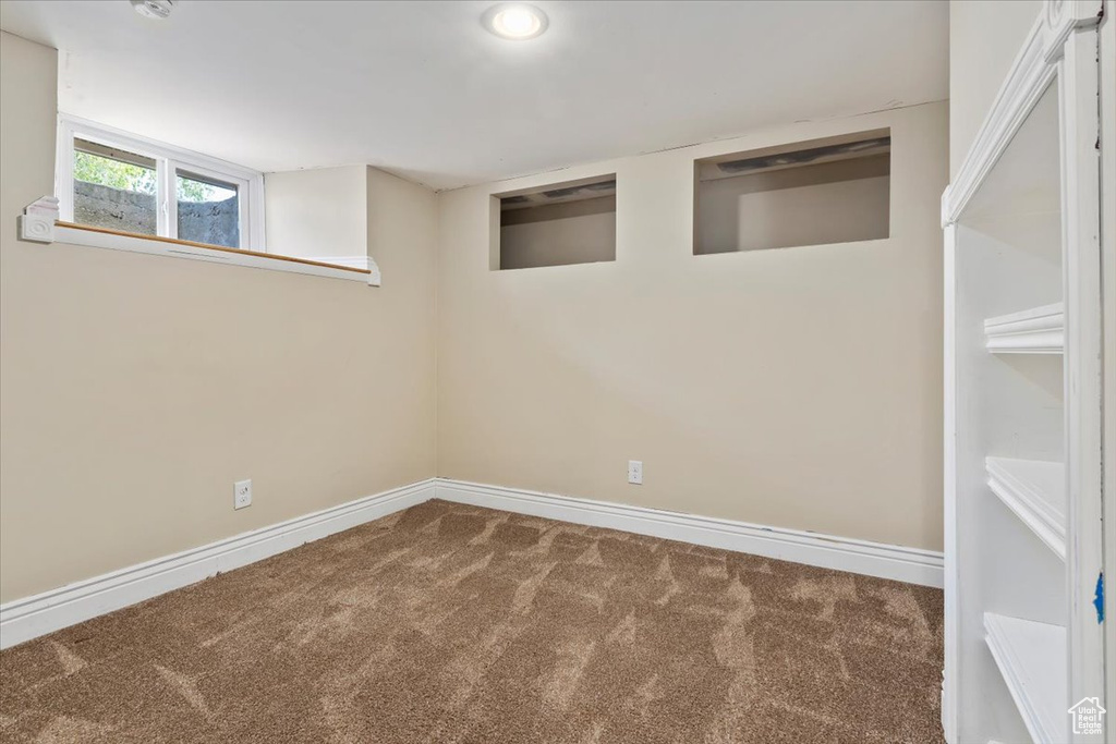 Basement with carpet floors, baseboards, and recessed lighting