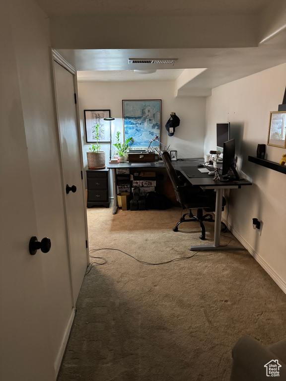 Carpeted office featuring baseboards