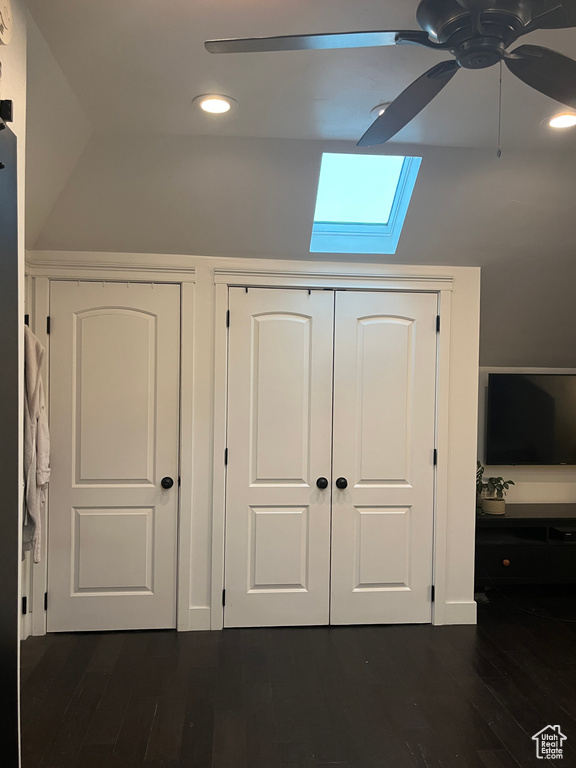 Detailed view of a skylight, a ceiling fan, wood finished floors, and recessed lighting
