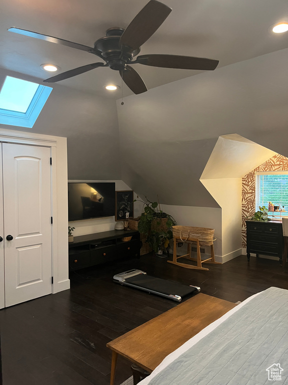 Bedroom featuring a skylight, recessed lighting, wood finished floors, vaulted ceiling, and a ceiling fan