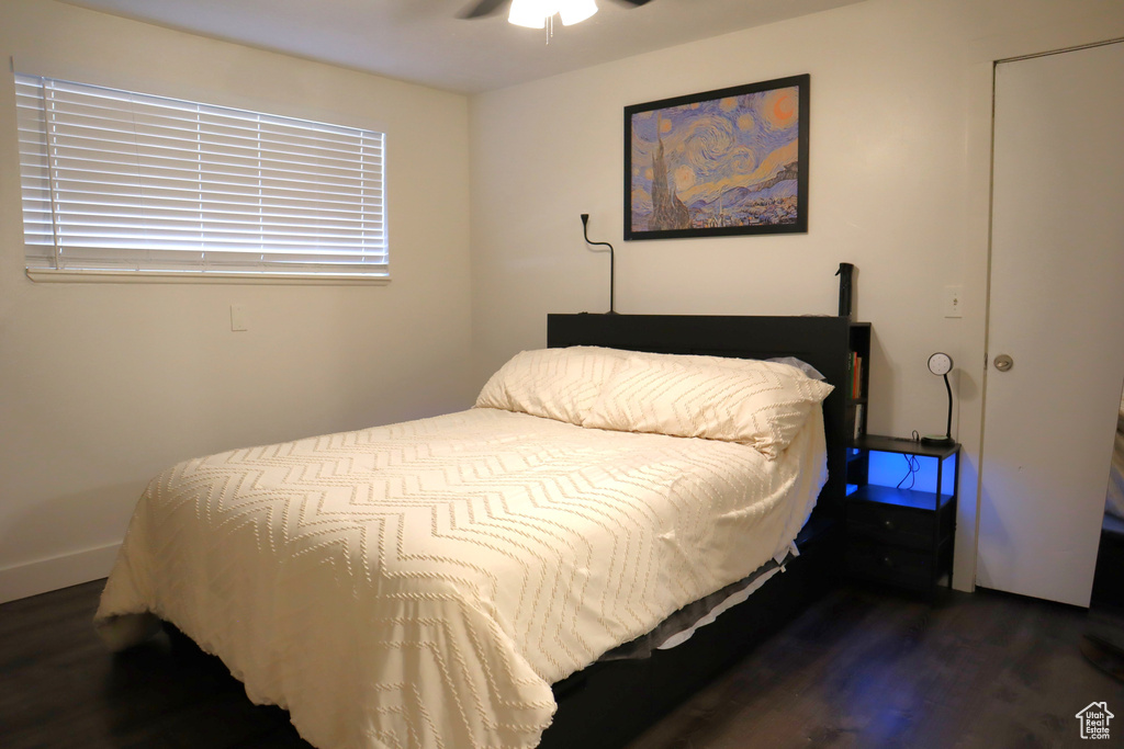 Bedroom featuring wood finished floors and a ceiling fan