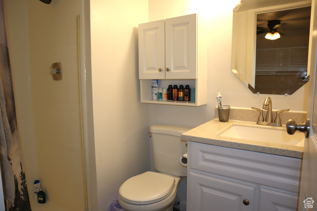 Full bath with a shower, toilet, and vanity