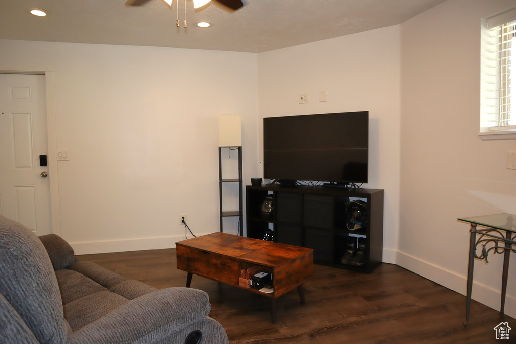 Living area with ceiling fan, baseboards, dark wood finished floors, and recessed lighting