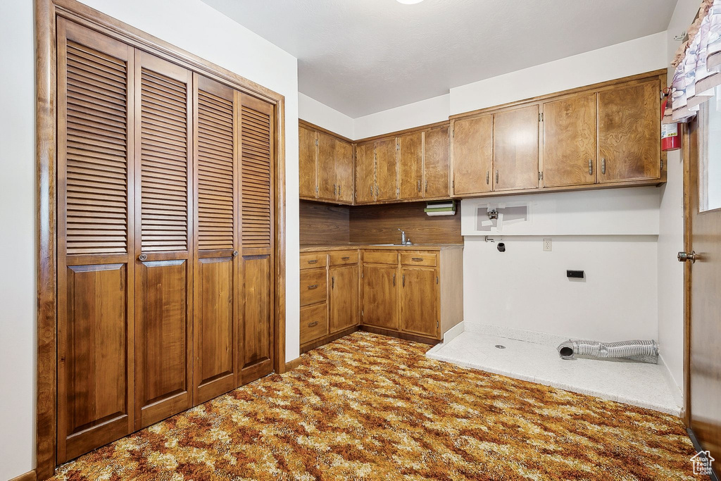 Washroom with cabinet space, carpet floors, electric dryer hookup, and hookup for a washing machine