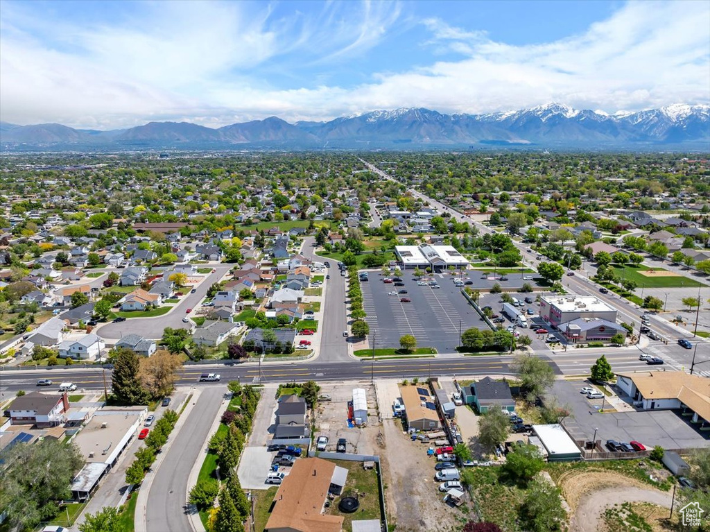 Aerial view of residential area featuring a mountain backdrop