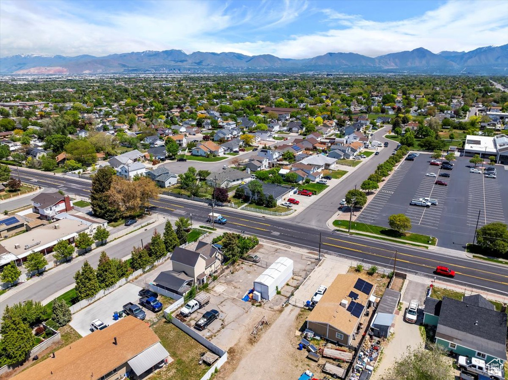Aerial perspective of suburban area featuring a mountain backdrop