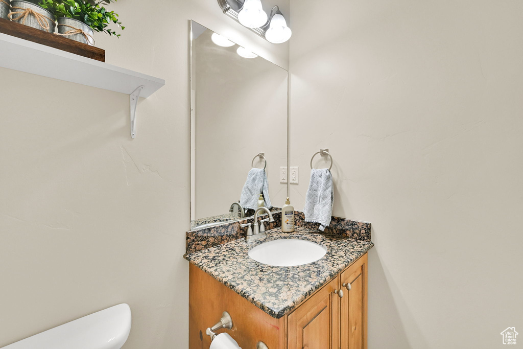 Half bath with toilet and vanity