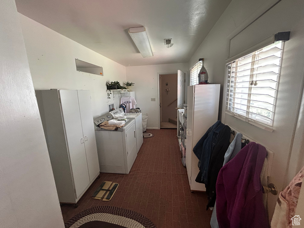 Hallway featuring washer and clothes dryer