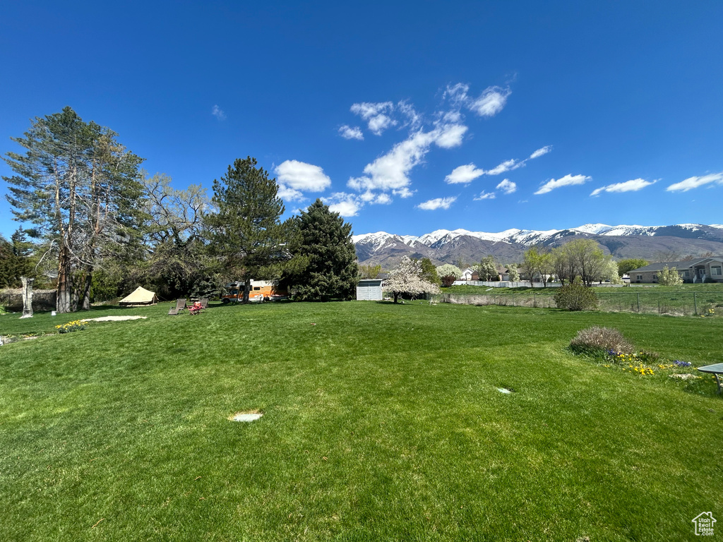 View of green lawn with a mountain view