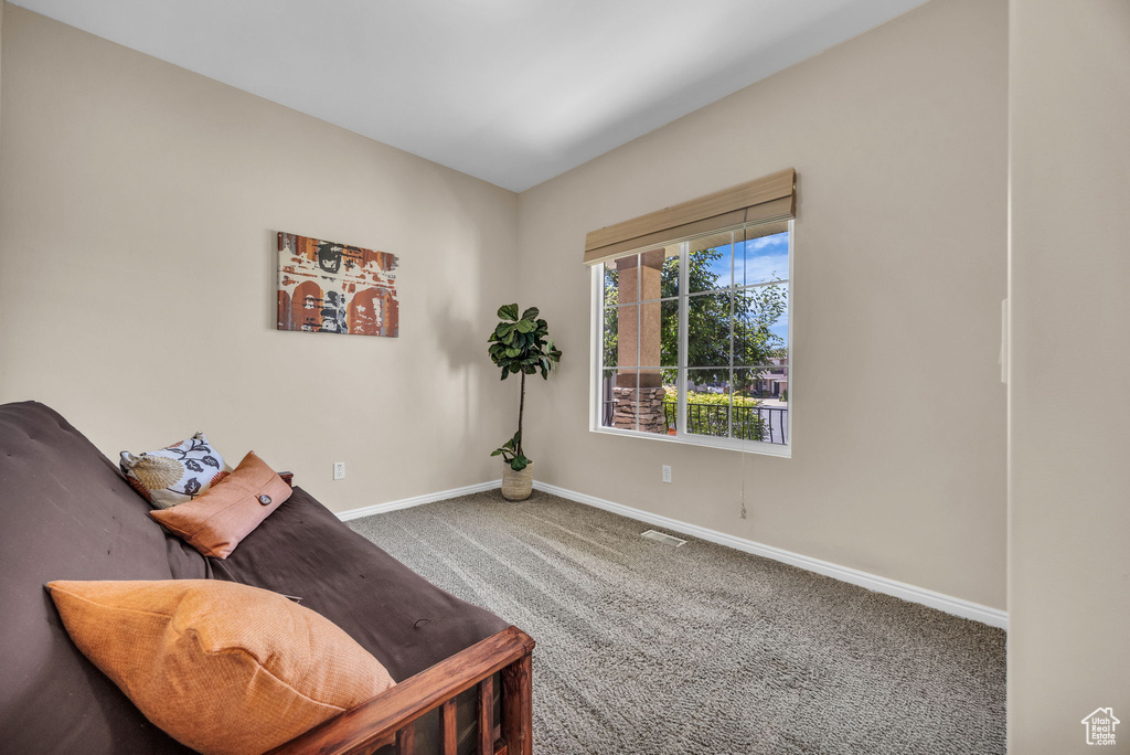 Living area with carpet floors and baseboards