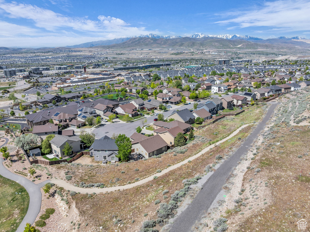 View of property location featuring mountains and nearby suburban area