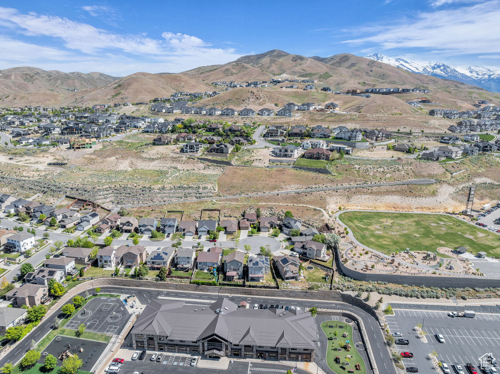 Aerial view of property\'s location with a mountainous background and nearby suburban area