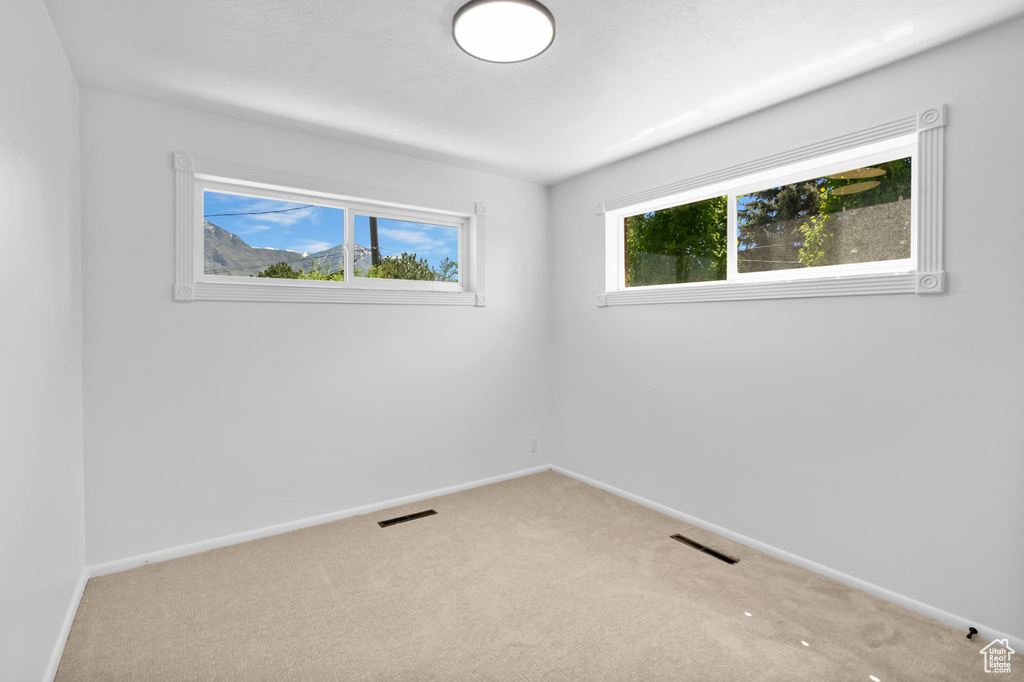 Spare room with carpet flooring and baseboards