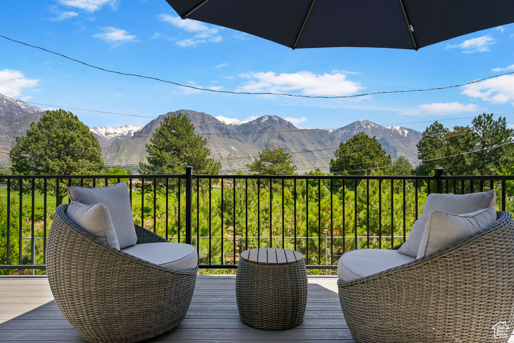 Wooden terrace featuring a mountain view
