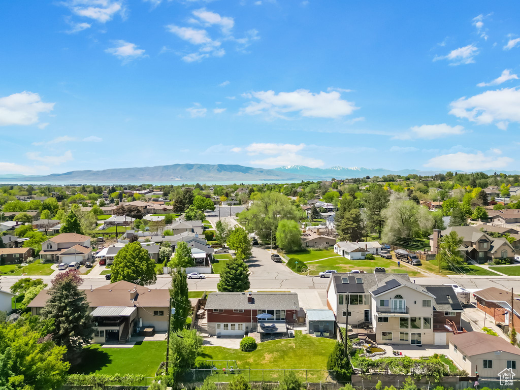 Aerial view of residential area featuring a mountain backdrop