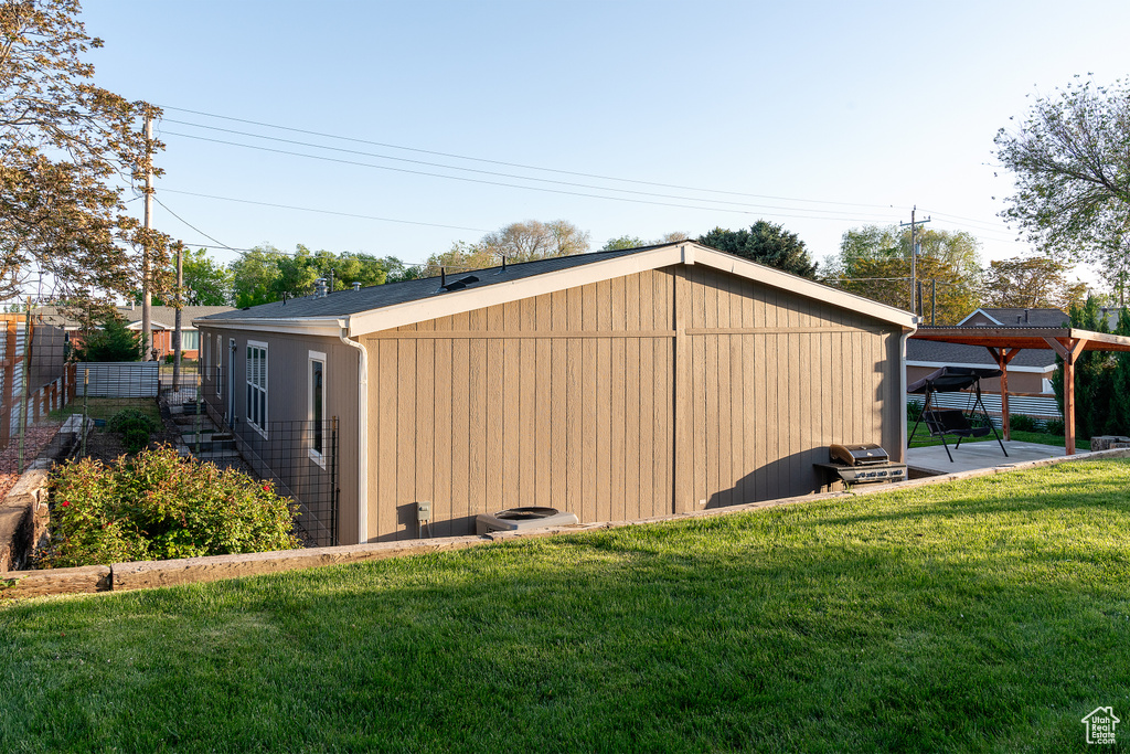 View of outbuilding featuring central AC unit