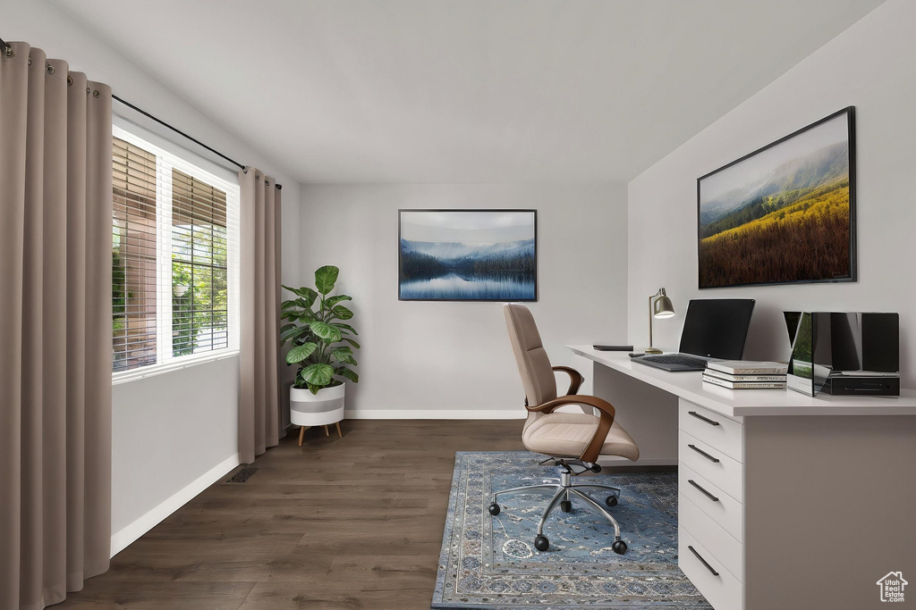 Office with baseboards and dark wood-style flooring