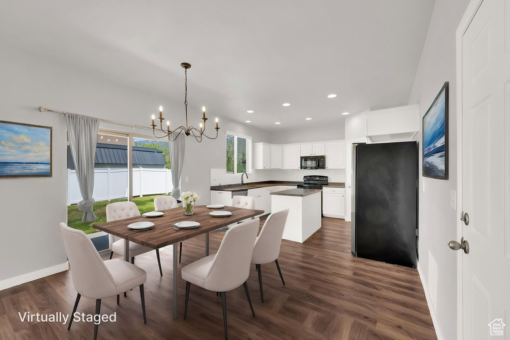 Dining space featuring a chandelier, recessed lighting, dark wood-style floors, and baseboards