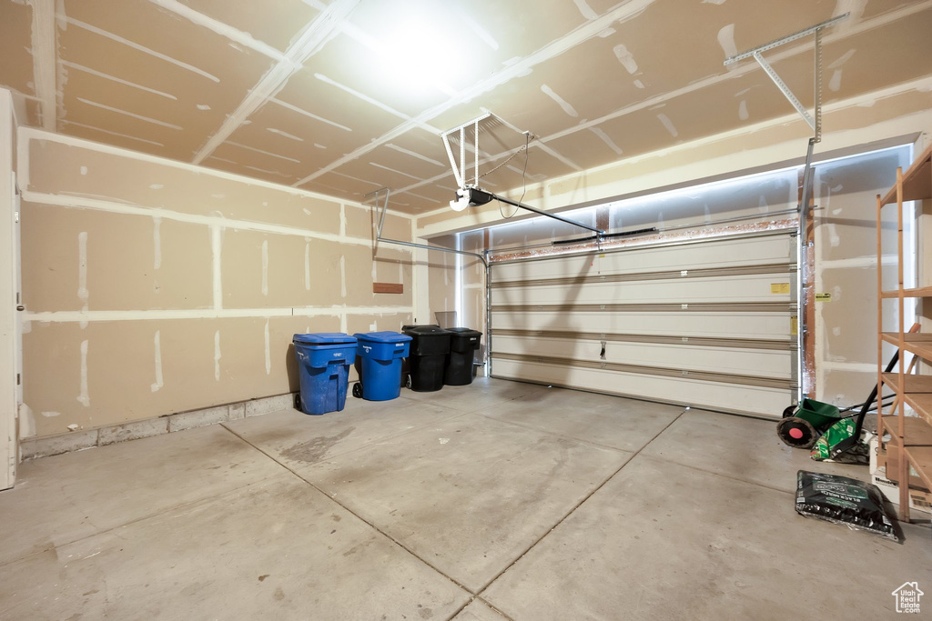 Garage featuring a garage door opener