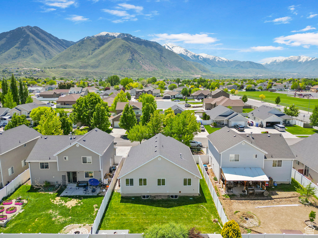 Aerial view of residential area with a mountainous background