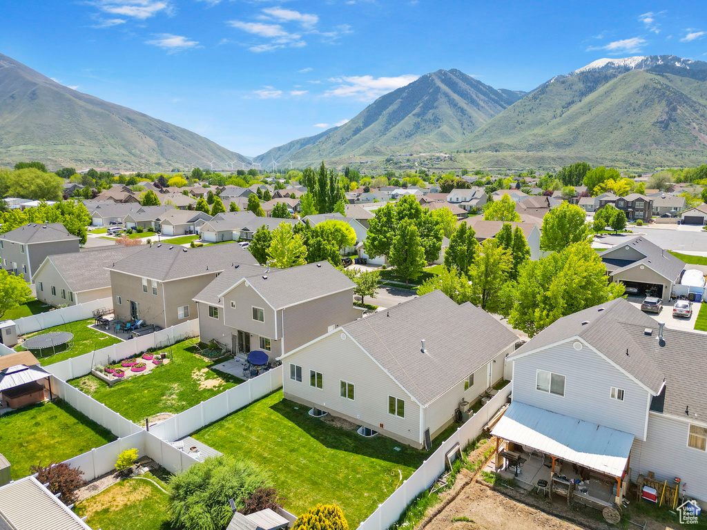 Aerial perspective of suburban area with a mountainous background