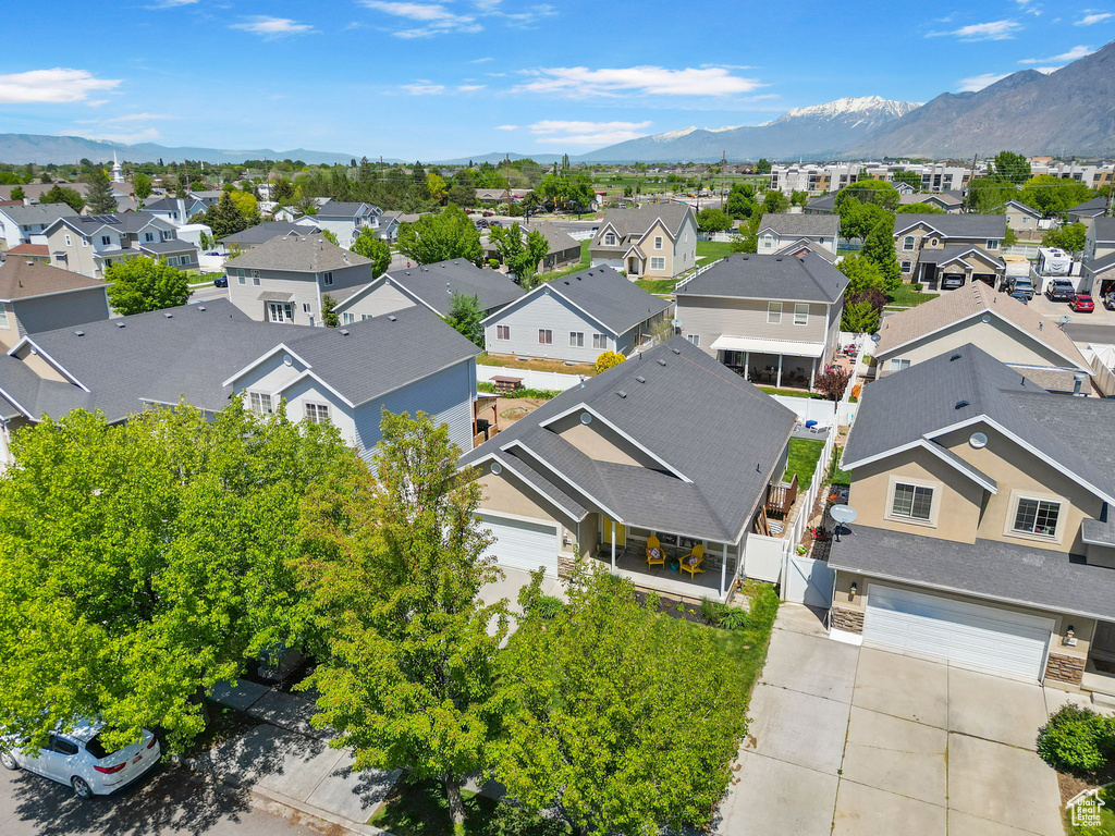 Aerial view of residential area featuring a mountainous background