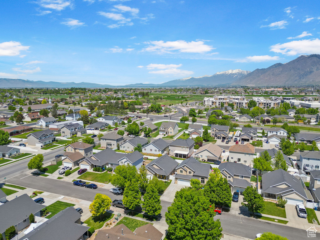 Aerial view of residential area featuring a mountain backdrop