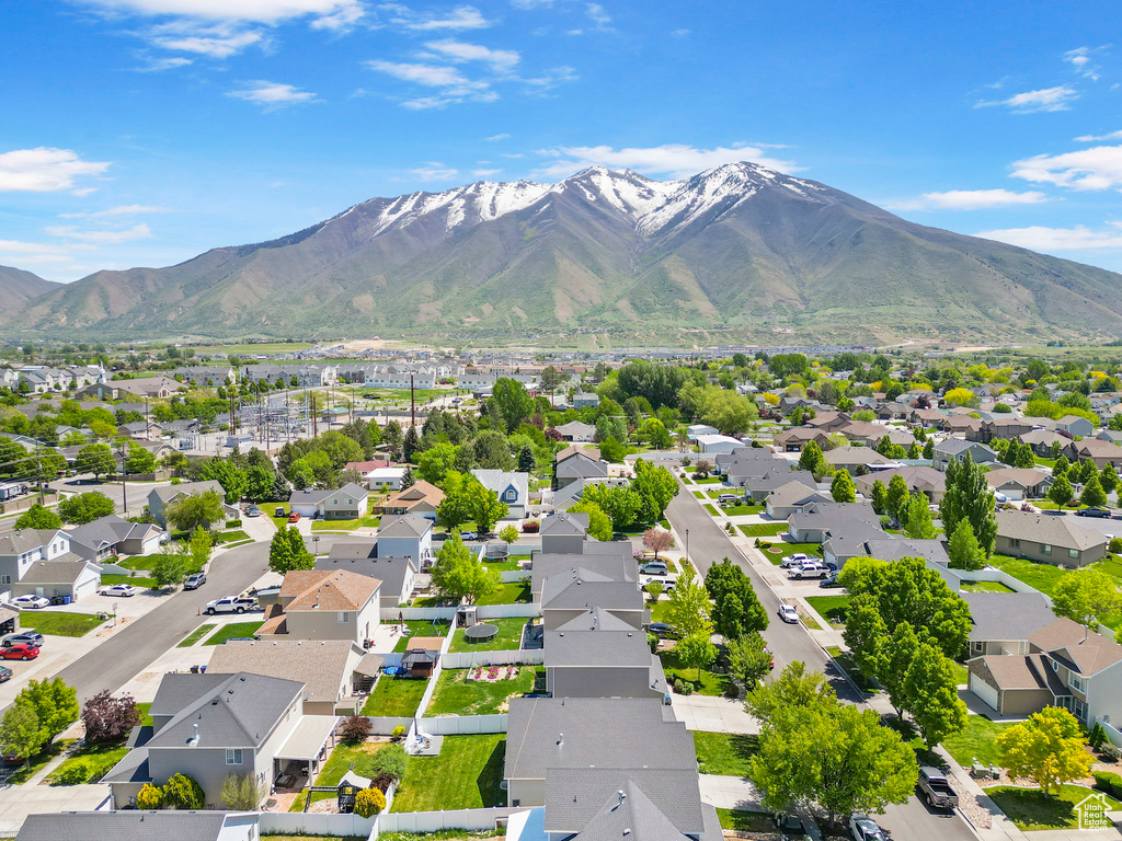 Aerial view of residential area featuring a mountainous background