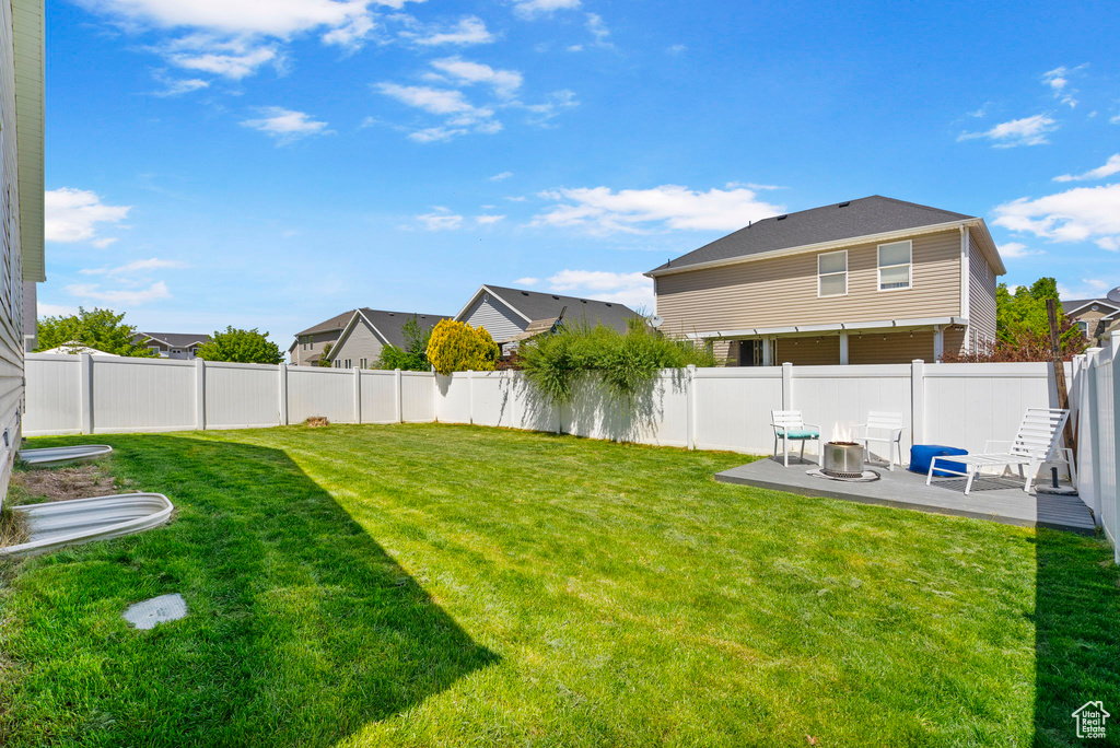 View of yard featuring a patio area and a residential view