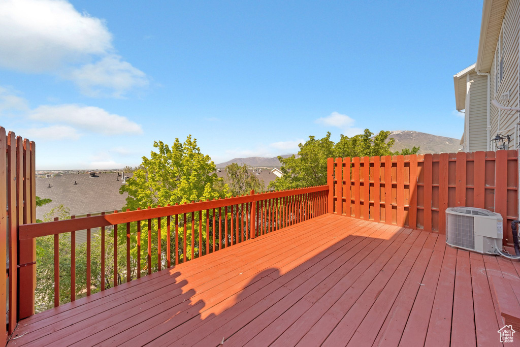 Deck featuring central AC and a mountain view