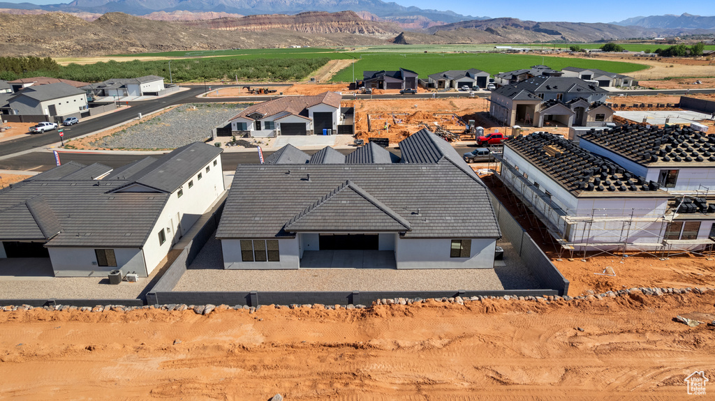 Aerial perspective of suburban area featuring a mountain backdrop